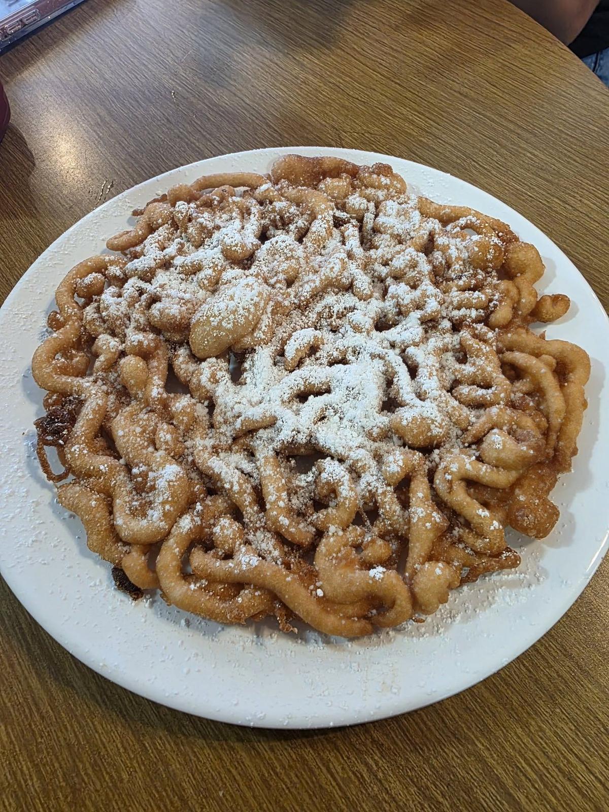 Funnel cake dusted with powdered sugar