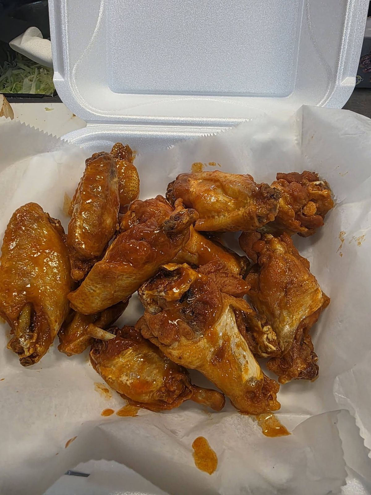 Crunchy fried wings tossed in sauce